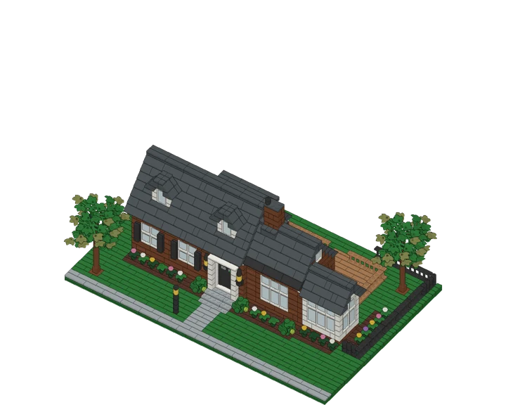 A 2,000-piece brick model of a house with a dark gray roof, dormers, a sunroom, deck and trees